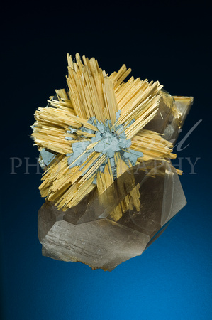 Rutile, hematite, quartz. 7 cm high; Brazil. T Bonisoli coll.